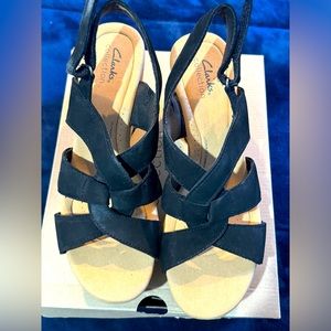 Clark’s black platform sandals